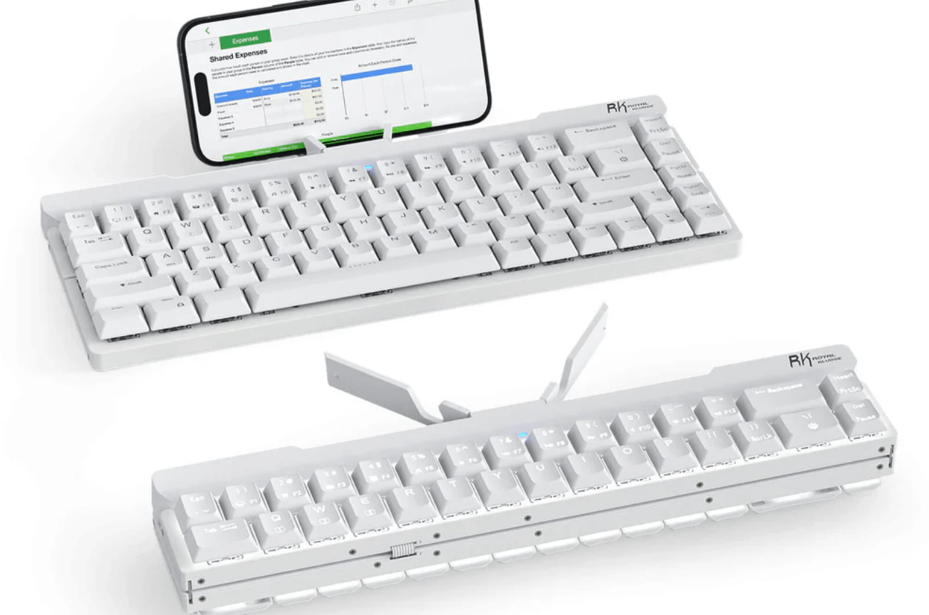 Two keyboards next to a phone, one opened, one folded.